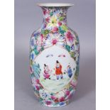 AN EARLY 20TH CENTURY CHINESE FAMILLE ROSE MILLEFLEUR GROUND PORCELAIN VASE, painted with two