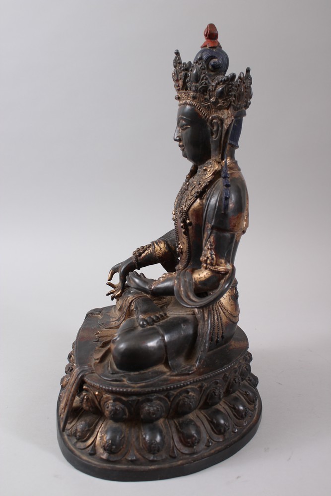 A CHINESE GILT BRONZE FIGURE OF A BUDDHA, seated upon a lotus formed base in a meditating position, - Image 5 of 7