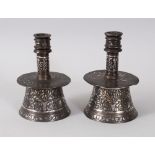 A VERY IMPORTANT 15TH CENTURY MAMLUK SILVER AND GOLD INLAID PAIR OF CIRCULAR CANDLESTICKS