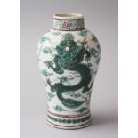 A 19TH CENTURY CHINESE FAMILEE VERTE PORCELAIN DRAGON VASE, decorated with scenes of two four clawed