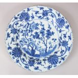 A CHINESE KANGXI BLUE & WHITE CHARGER, with floral decoration, 39cm diameter, (AF)