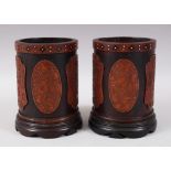 A LOVELY PAIR OF 19TH CENTURY CHINESE CANTON BAMBOO BRUSH POTS, each pot with four applied carved