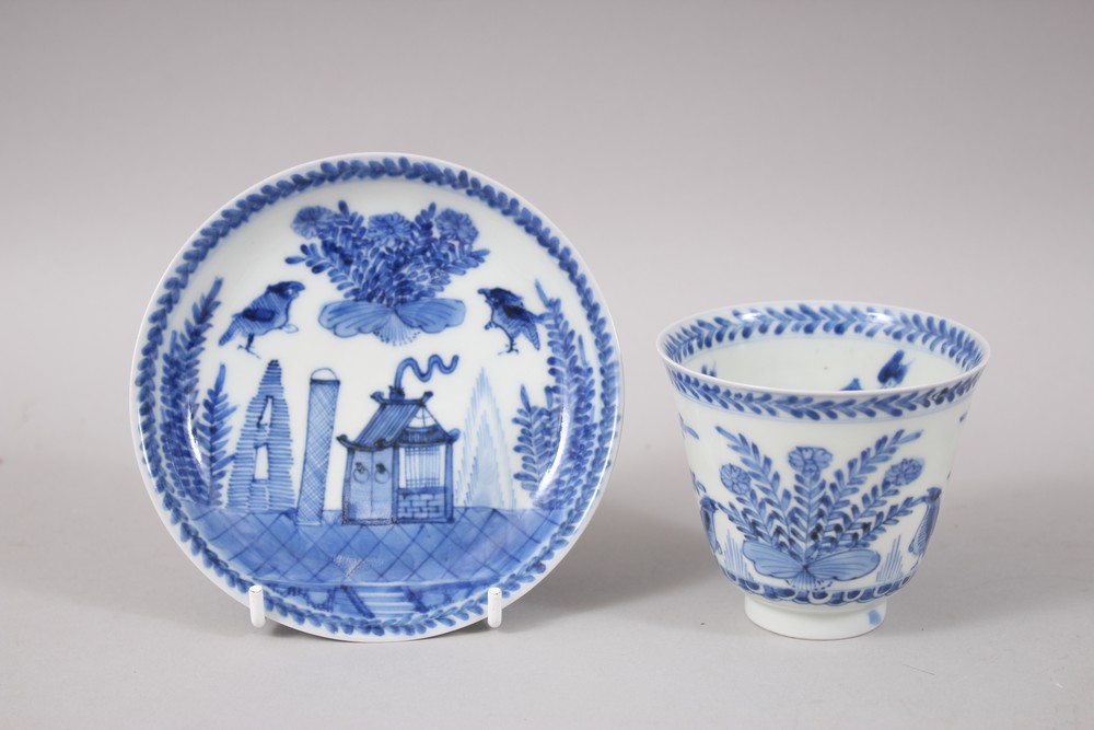 A CHINESE KANGXI BLUE & WHITE PORCELAIN WINE CUP & SAUCER, the interior of the cup decorated with