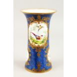 A SIMILAR STAFFORDSHIRE SPILL VASE, painted with panels of birds and insects. 21cms high.