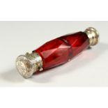 A VERY GOOD VICTORIAN FACET CUT RUBY GLASS DOUBLE ENDED SCENT BOTTLE with engraved silver caps. 11.