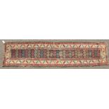 A PERSIAN CAUCASIAN RUNNER. 13ft x 2ft 11ins.