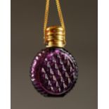 A SMALL VICTORIAN PURPLE-COLOURED GLASS SCENT BOTTLE with plated top and chain. 4cms diameter.