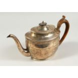 A GEORGE III OVAL TEAPOT with gadrooned edge, wooden finial and handle. London 1803. Maker Daniel