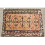 AN ARMENIAN RUG with five diamond shaped motifs and triple row border. 4ft 9ins x 3ft 4ins.