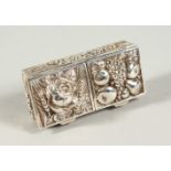 A CONTINENTAL SILVER DOUBLE STAMP BOX repousse with fruit. 2ins long.