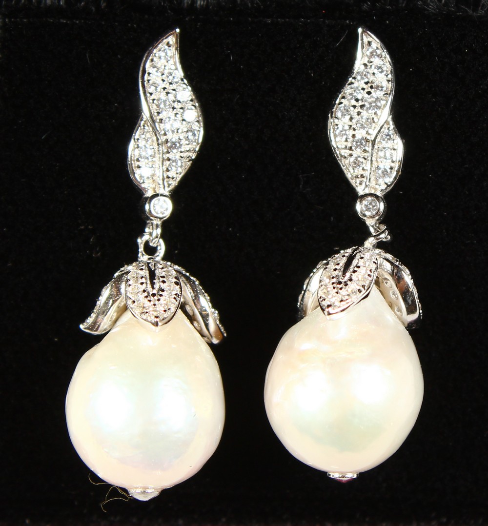 A PAIR OF SILVER AND BAROQUE PEARL DROP EARRINGS, boxed.