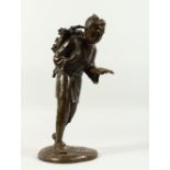 A LARGE 19TH CENTURY JAPANESE BRONZE FIGURE OF A MAN, faggotson his head and carrying a book.