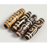 FOUR AGATE TIBETAN BEADS.