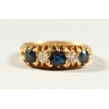 AN 18CT GOLD, SAPPHIRE AND DIAMOND FIVE STONE RING.