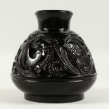 A RARE 1920'S ART DECO BLACK GLASS BULBOUS VASE with a panel of deer, birds, panther and scrolls.