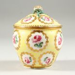 A 19TH CENTURY SEVRES BOWL AND COVER, pale yellow ground, decorated all over with rose buds. 9cms