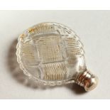 A SMALL CUT GLASS SCENT BOTTLE AND STOPPER with screw off top. 3cms diameter.