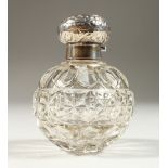 AN EDWARD VII CUT GLASS GLOBULAR SCENT BOTTLE with screw off silver top and band. Birmingham 1902.