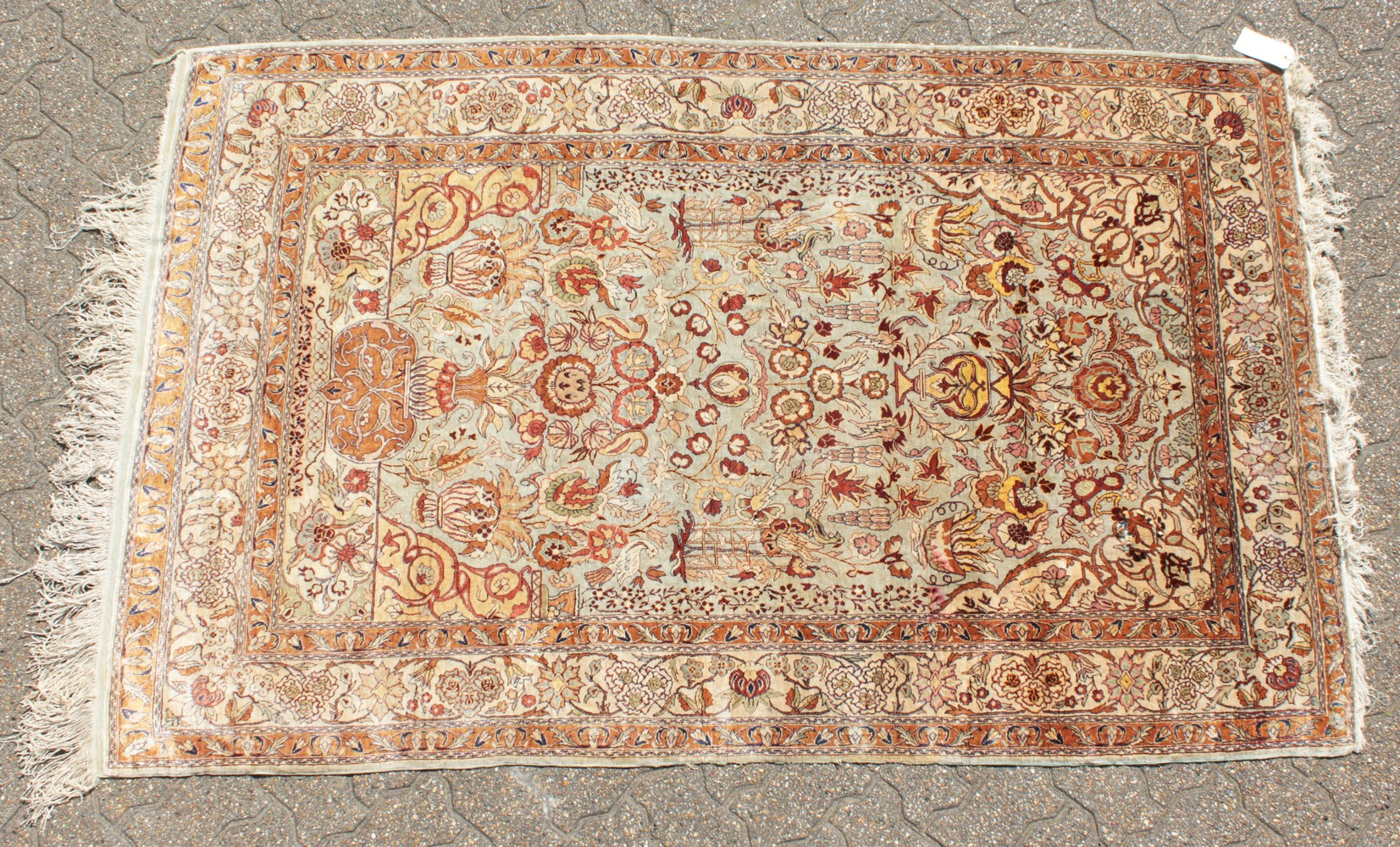 A FINE TURKISH SILK RUG with allover pattern of birds and flowers. 6ft 10ins x 4ft 3ins.