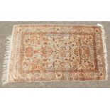 A FINE TURKISH SILK RUG with allover pattern of birds and flowers. 6ft 10ins x 4ft 3ins.