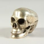 A PLATED SKULL. 4.5ins long.