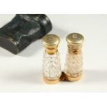 A RARE VICTORIAN CUT GLASS FOLDING DOUBLE ENDED SCENT BOTTLE as a pair of binoculars in a leather