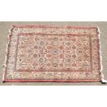 A LARGE PERSIAN KASHAN RUG with allover design on a cream ground. 4ft 2ins x 4ft 4ins.
