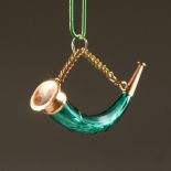 A TINY 19TH CENTURY FACET CUT GREEN GLASS HORN SHAPED SCENT BOTTLE on a chain. 3.5cms long.