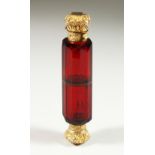 A GOOD VICTORIAN RUBY GLASS FACET CUT DOUBLE ENDED SCENT BOTTLE with repousse silver gilt ends.