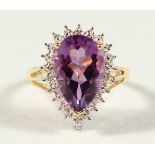 A GOOD 9CT GOLD TEAR DROP AMETHYST AND DIAMOND RING, boxed.