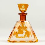 A GOOD BOHEMIAN AMBER DECANTER AND STOPPER etched with deer. 9cms high.