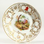 A 19TH CENTURY MEISSEN DEER HUNTING PLATE. 9.5ins diameter. Cross sword mark with crest. Provenance: