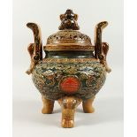A LARGE JAPANESE GREEN GLAZED PORCELAIN KORO AND COVER with pierced top. 13ins high x 8ins