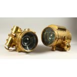 A SUPERB PAIR OF VICTORIAN BRASS CIRCULAR CAR LAMPS, the glass fronts. 18cms diameter x 26cms long.