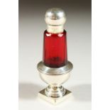 A VICTORIAN RUBY GLASS PEPPER POT SCENT BOTTLE with silver top and pedestal base. Birmingham 1899.