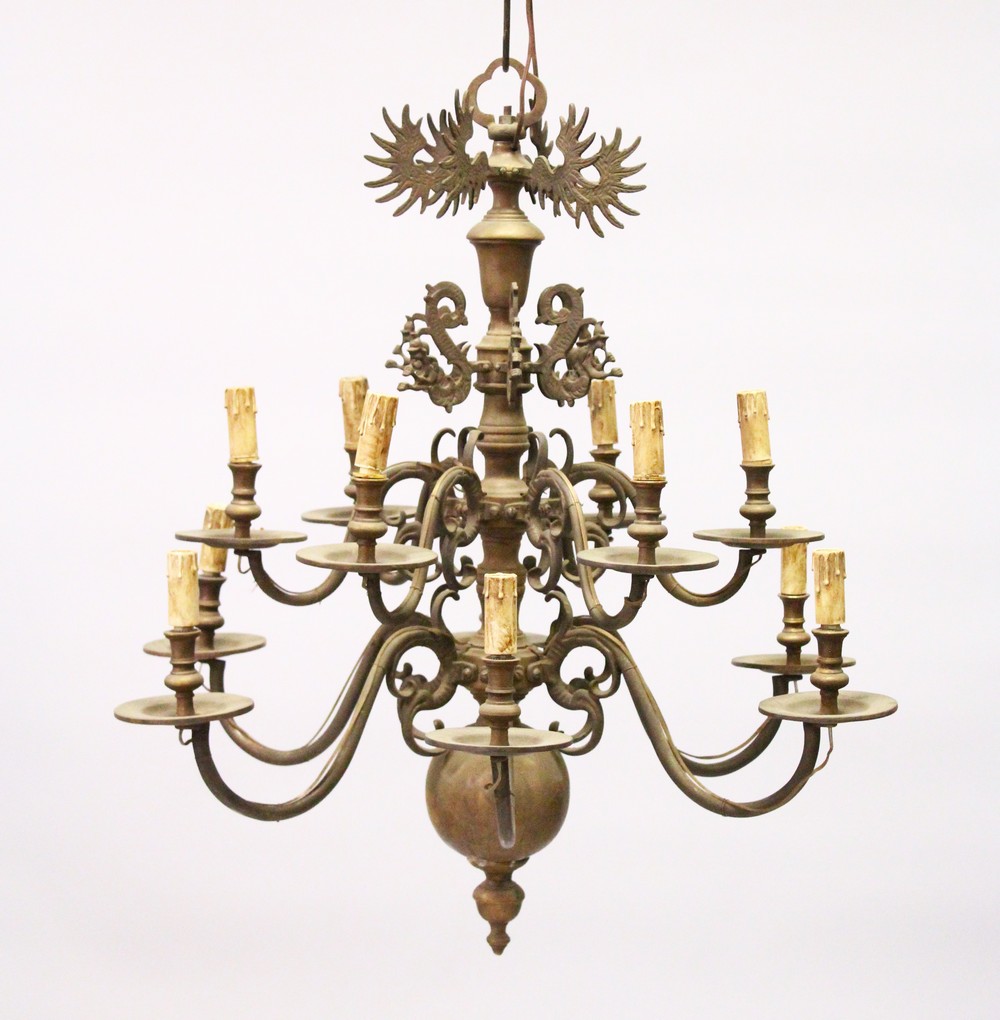 A GOOD DUTCH BRASS TWO TIER CHANDELIER with twelve scrolling branches. 2ft 6ins high x 2ft wide.