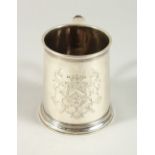 A SUPERB GEORGE I MUG by PAUL DE LAMERIE with plain sides and C scroll handle with crest. London