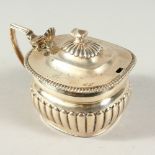 A GEORGE III SEMI-FLUTED MUSTARD POT AND COVER with gadrooned edge. London 1809.