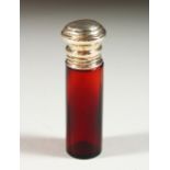 A PLAIN VICTORIAN RUBY GLASS SCENT BOTTLE with silver top. 8.5cms long x 2cms diameter.