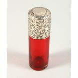 A VICTORIAN PLAIN RUBY GLASS SCENT BOTTLE with engraved silver screw off cap. London 1887. Maker