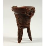 A HORN LIBATION CUP on three curving legs. 4.5ins high.