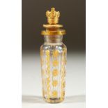 A VIENNA GILDED GLASS SCENT BOTTLE with screw off top as a crown. 7.5cms long.
