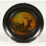 A CIRCULAR PAINTED PAPIER MACHE PLAQUE, Nude on horseback. 8.5cms diameter.