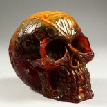 AN AMBER SKULL. 15cms long.