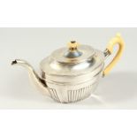 AN EARLY 19TH CENTURY RUSSIAN ST. PETERSBURG SEMI FLUTED OVAL TEAPOT with ivory handle and finial.