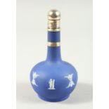 A WEDGWOOD BLUE AND WHITE JASPER WARE BOTTLE VASE with silver top, on a chain. 10.5cms high.
