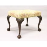 A CHIPPENDALE STYLE MAHOGANY FRAMED STOOL, 20th Century, with overstuffed seat on well carved