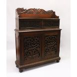 A 19TH CENTURY ANGLO INDIAN PADAUK WOOD CHIFFONIER, with carved back rail, over a pair of small