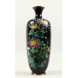 A GOOD JAPANESE BLUE GROUND CLOISONNE ENAMEL VASE decorated with chrysanthemums and other flowers.