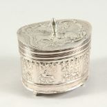 A GOOD DUTCH OVAL SILVER TEA CADDY with hinged cover, all repousse with flowers and animals. 7cms